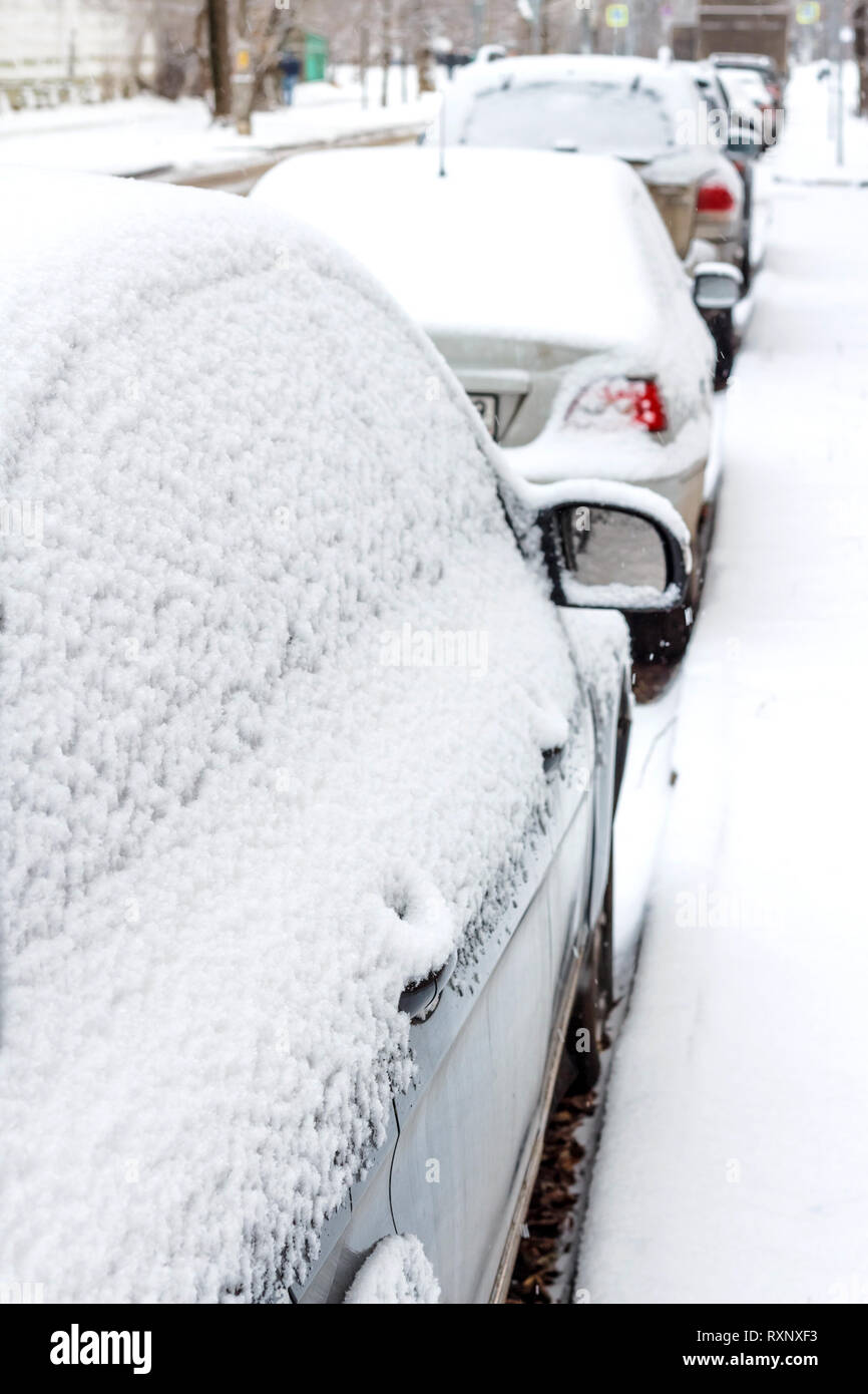 The parked cars in snow. Winter urban scene Stock Photo - Alamy