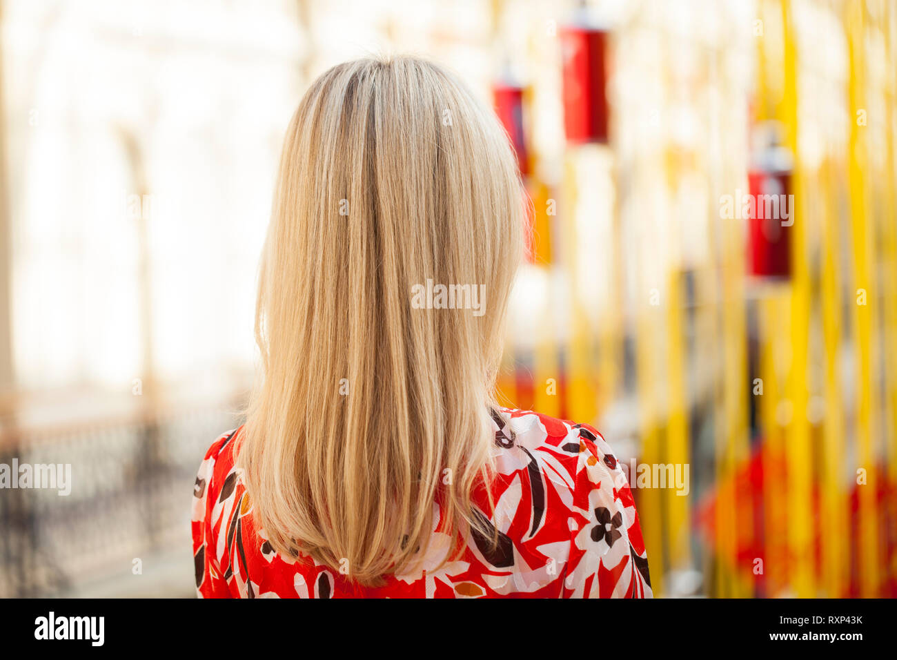 Rear view of blonde woman with hair in ponytail - wide 5