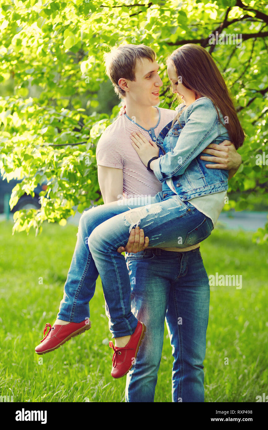 Young happy couple in love outdoors. loving man and woman on a walk in ...