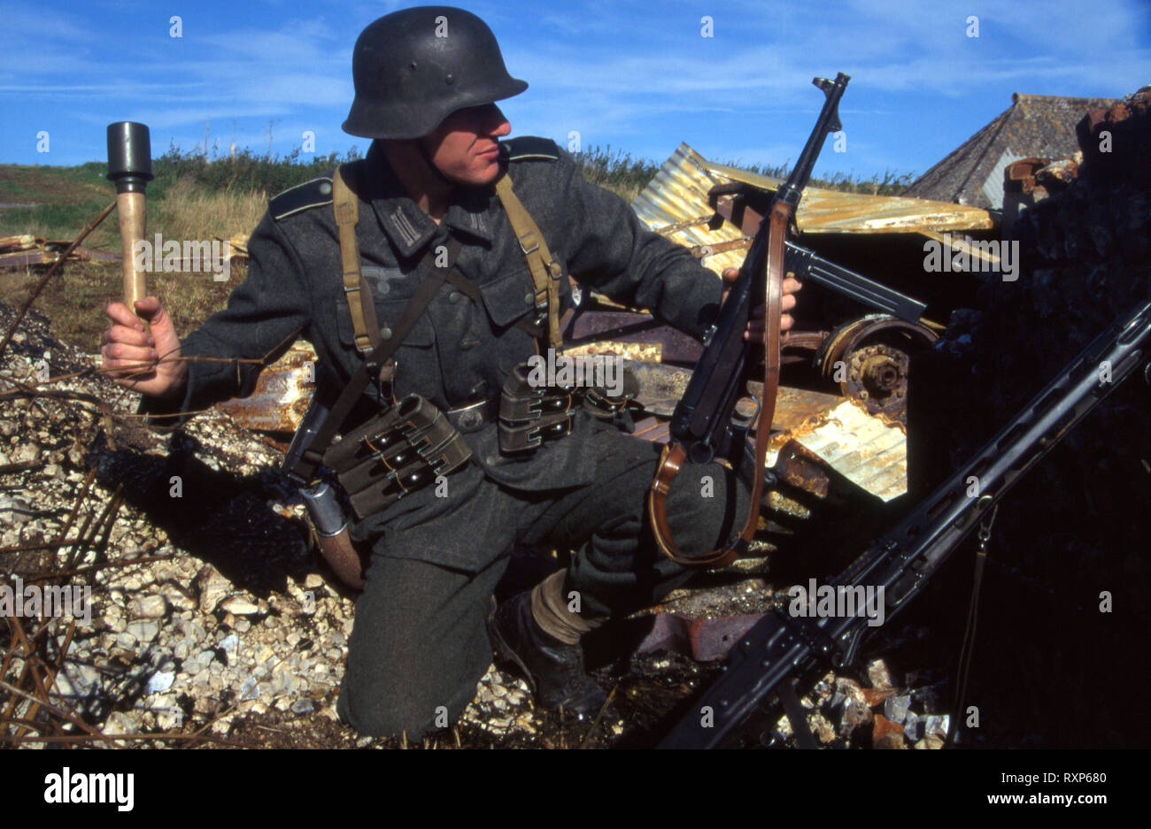 WW2 German Soldier throwing Grenade (Reenactor) Stock Photo