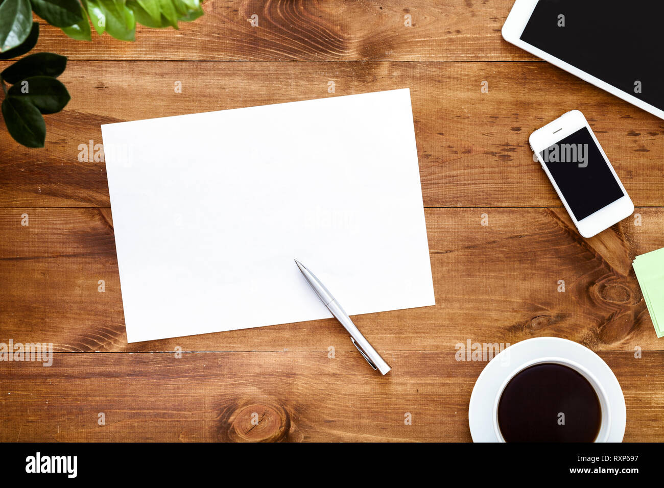 Work space desk with empty white blank paper sheet for notes pen and ...