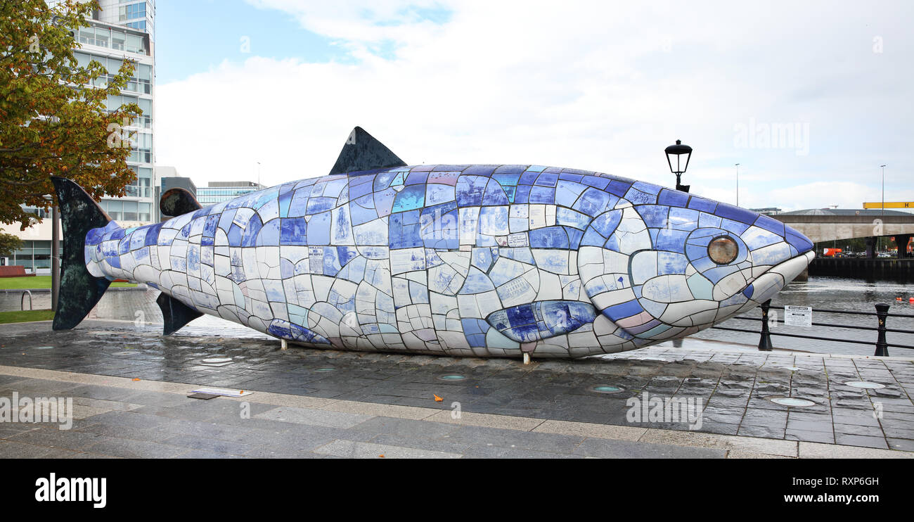 The Salmon of Knowledge, aka The Big Fish, is a 10-meter-long, ceramic-tiled sculpture constructed in 1999 by artist John Kindness and located at Donegall Quay, Belfast, Northern Ireland Stock Photo