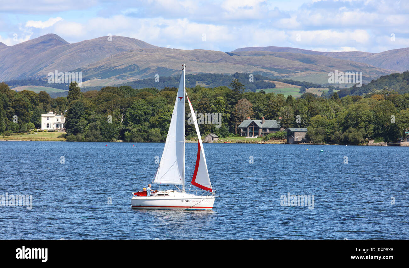 Sail boat on Lake Windermere in the Lake District, county of Cumbria, Ireland. The Lake District is a UNESCO World Heritage Site Stock Photo