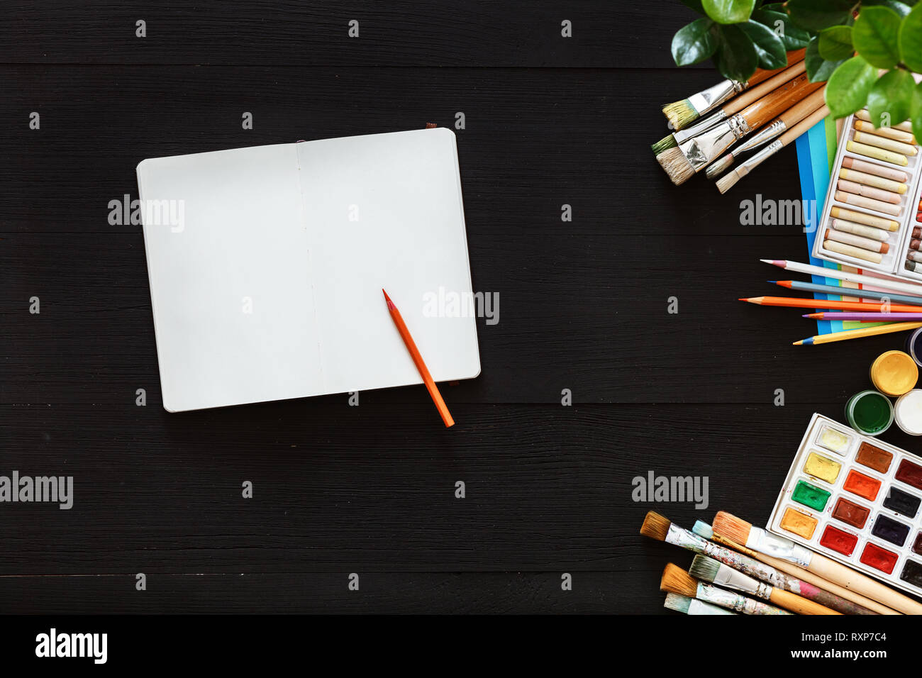 Creative art work table concept, mock up blank notebook sketchbook