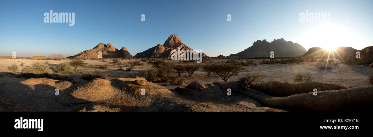 A panoramic image of sunrise over the Spitzkoppe, Namibia. Stock Photo