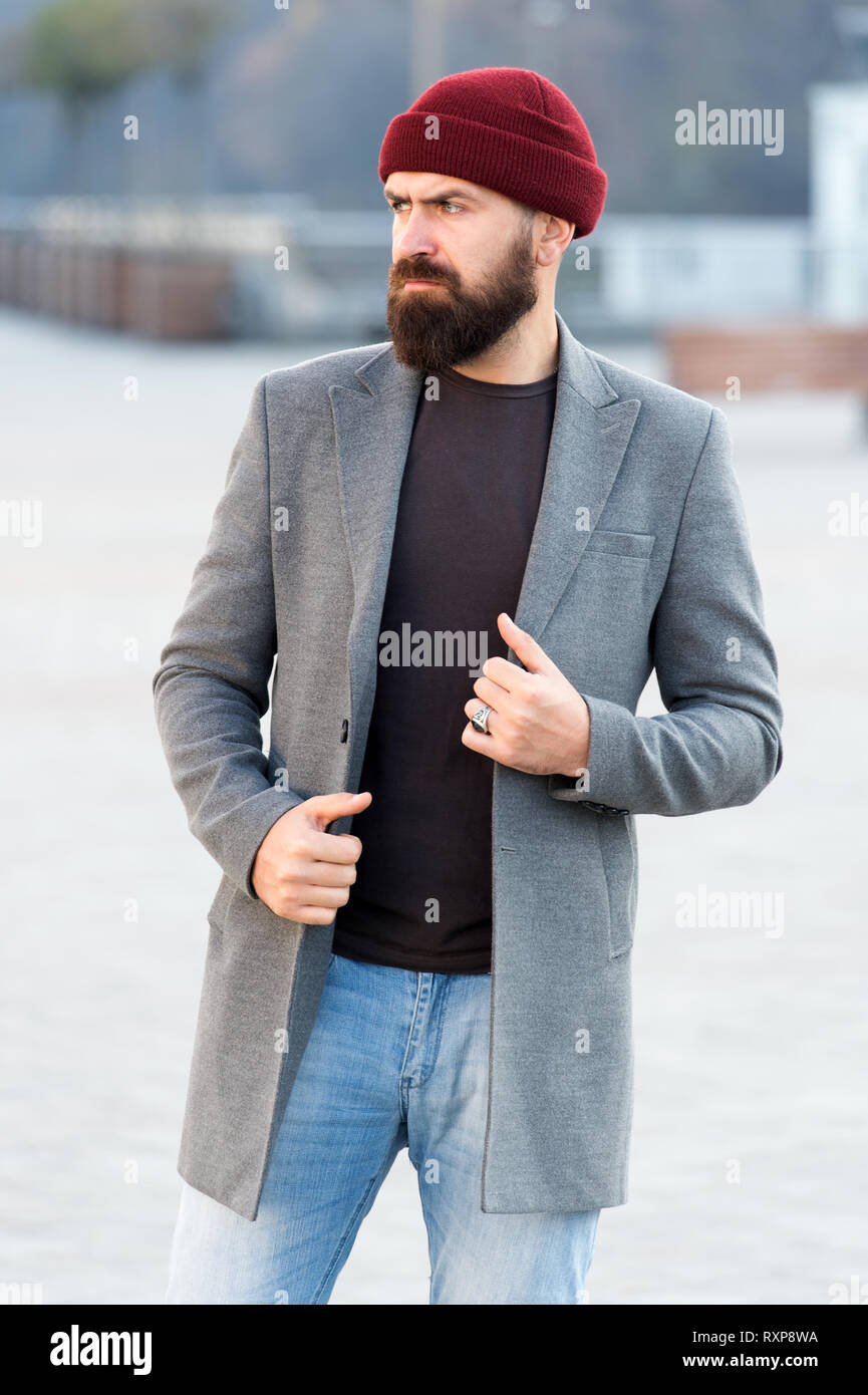 Man bearded hipster stylish fashionable coat and hat. Comfortable outfit. Achieve desired fit. Hipster outfit and hat accessory. Stylish casual outfit spring season. Menswear and male fashion concept ...