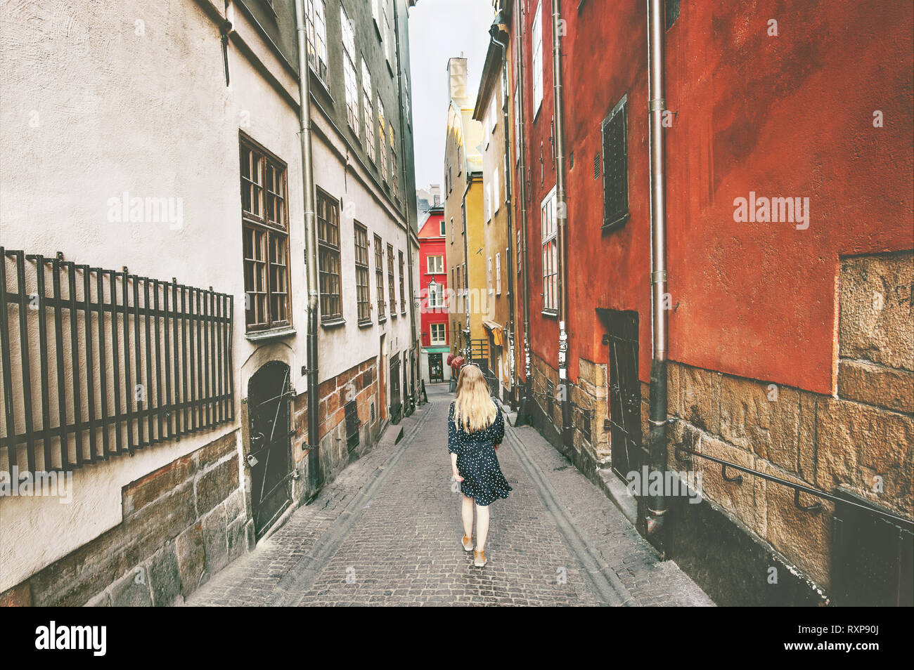 Stockholm city tour woman walking traveling alone lifestyle summer vacations in Sweden old street Stock Photo
