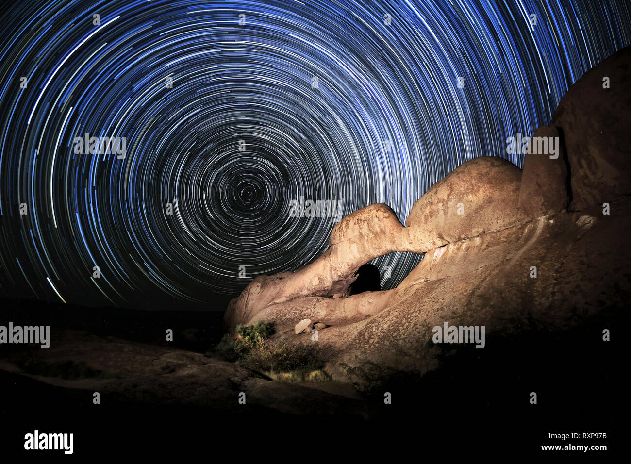 Star trail over the rock arch at the Spitzkoppe Stock Photo