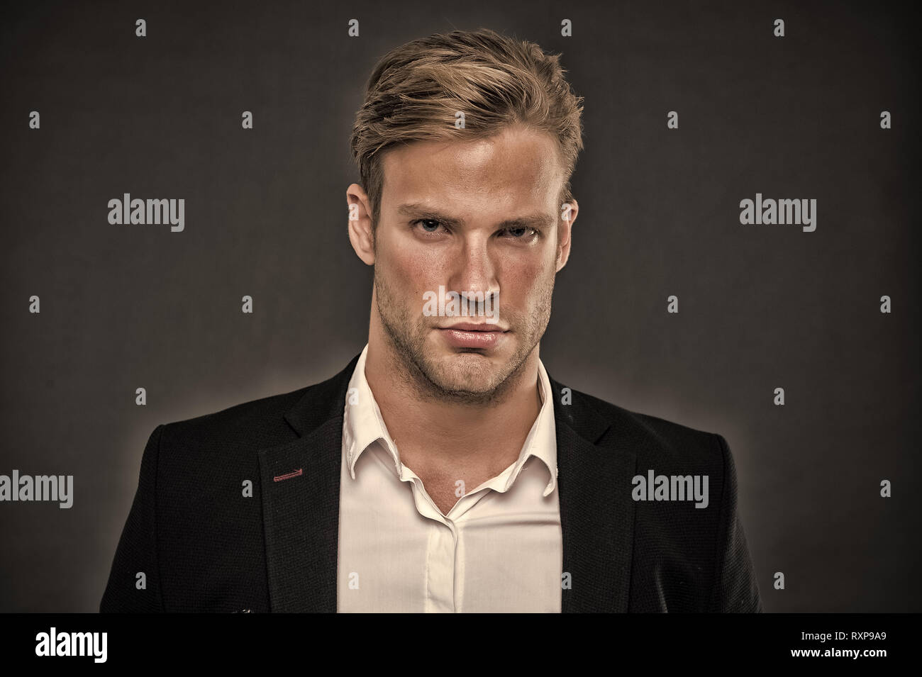 Guy confident in his appearance. Confidence and masculinity. Guy handsome  attractive formal wear. Man well groomed with bristle and hairstyle grey  background. Macho confident strict face close up Stock Photo - Alamy