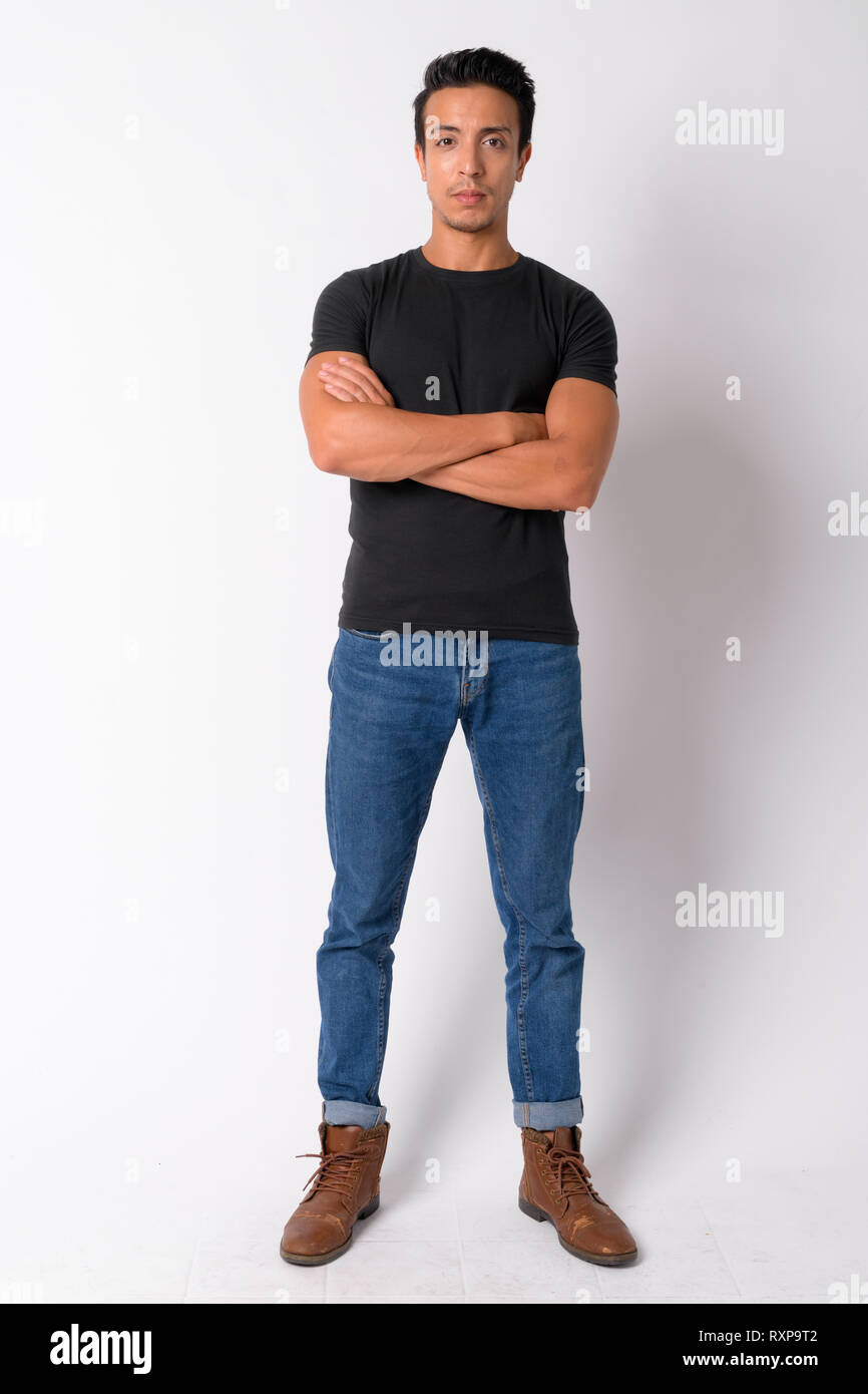 Full body shot of handsome Hispanic man with arms crossed Stock Photo ...
