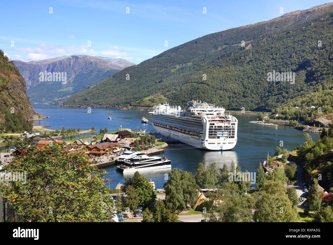 Cruise ship docked at the port of Flam, Norway. The body of water is the Aurlandsfjord Stock Photo