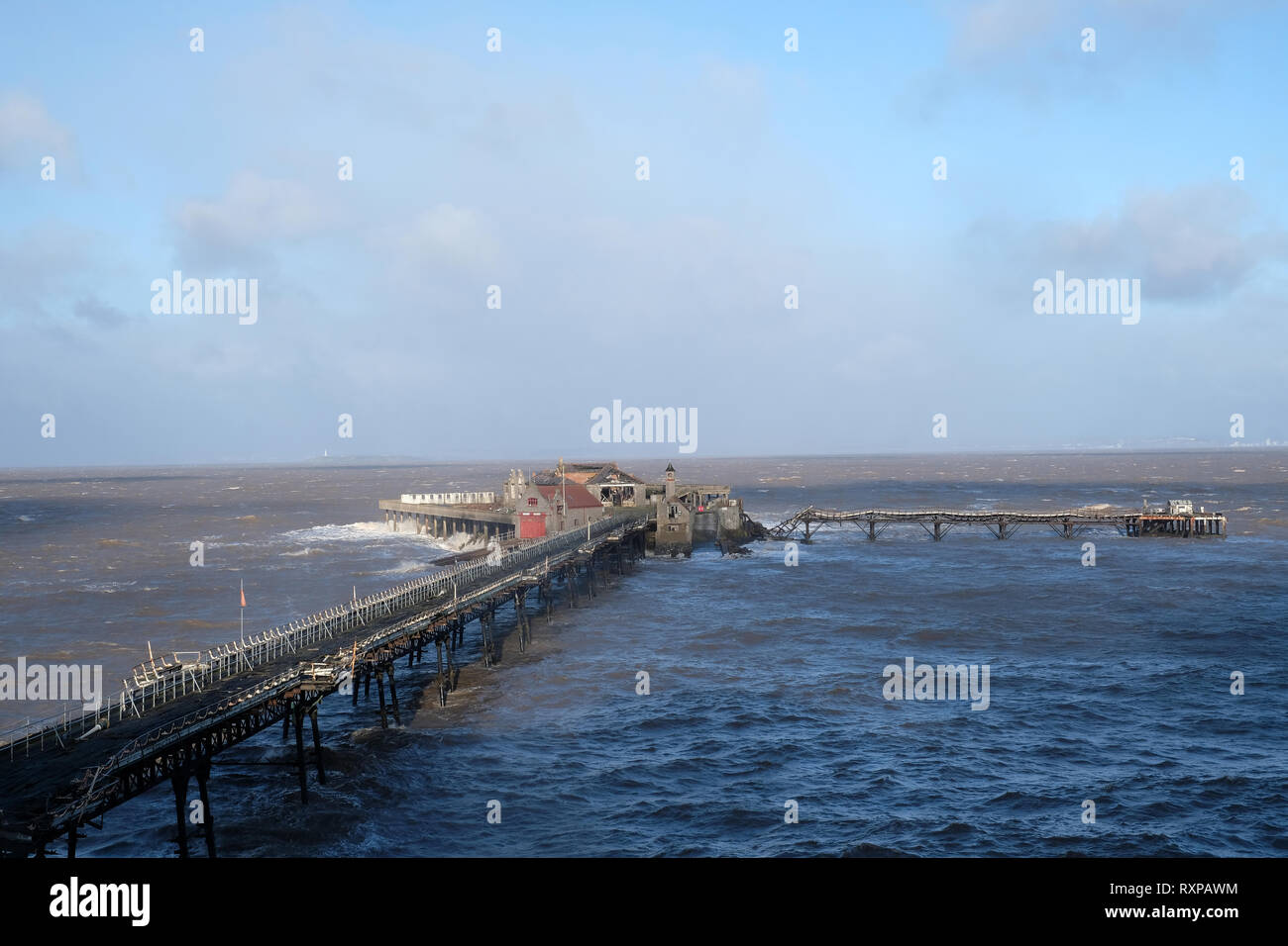 March 2019 - Rough seas batter the old Birnbeck Pier north of Weston super Mare,Somerset,England, UK Stock Photo