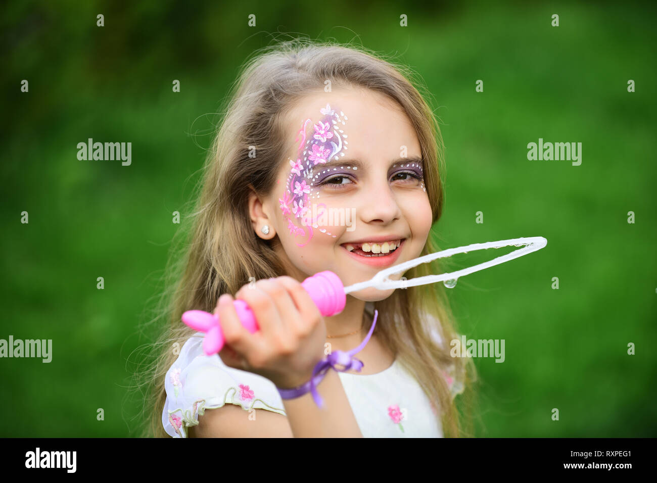 little girl play with bubble blower Stock Photo - Alamy