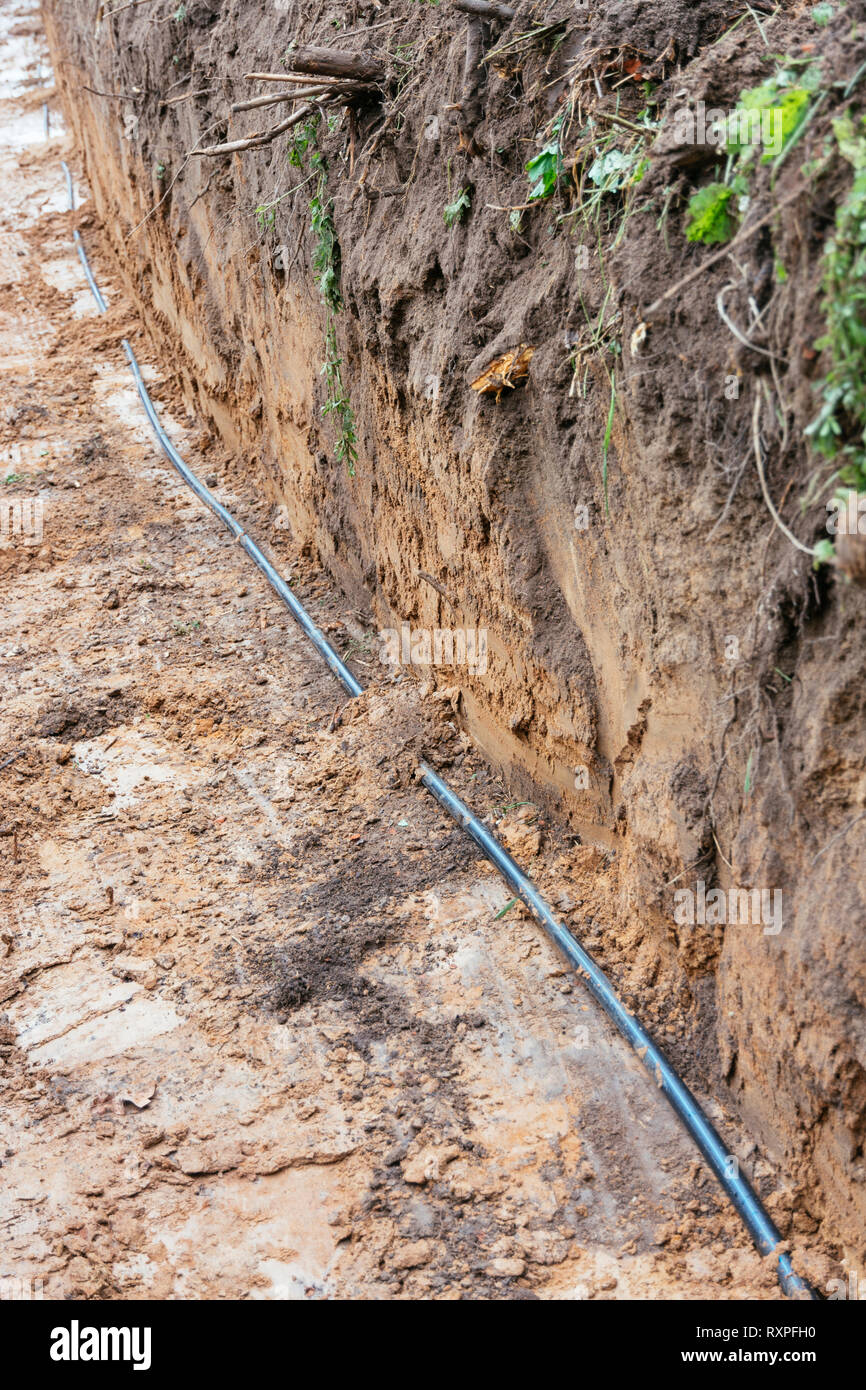 Pipes for geothermal heat pump being installed. Stock Photo