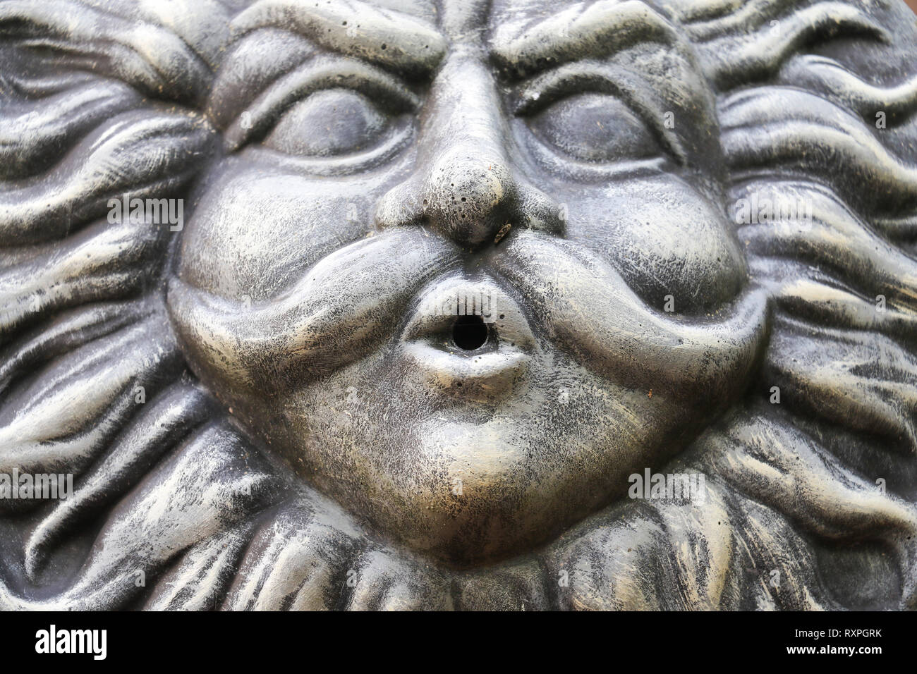 Garden decoration of old man winter blowing the wind Stock Photo - Alamy