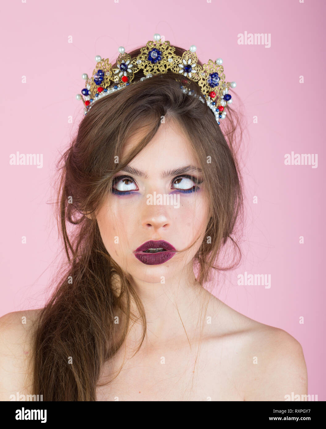 Emotional queen with crazy face and fashionable makeup in crown. Surprised  queen with trendy makeup Stock Photo - Alamy