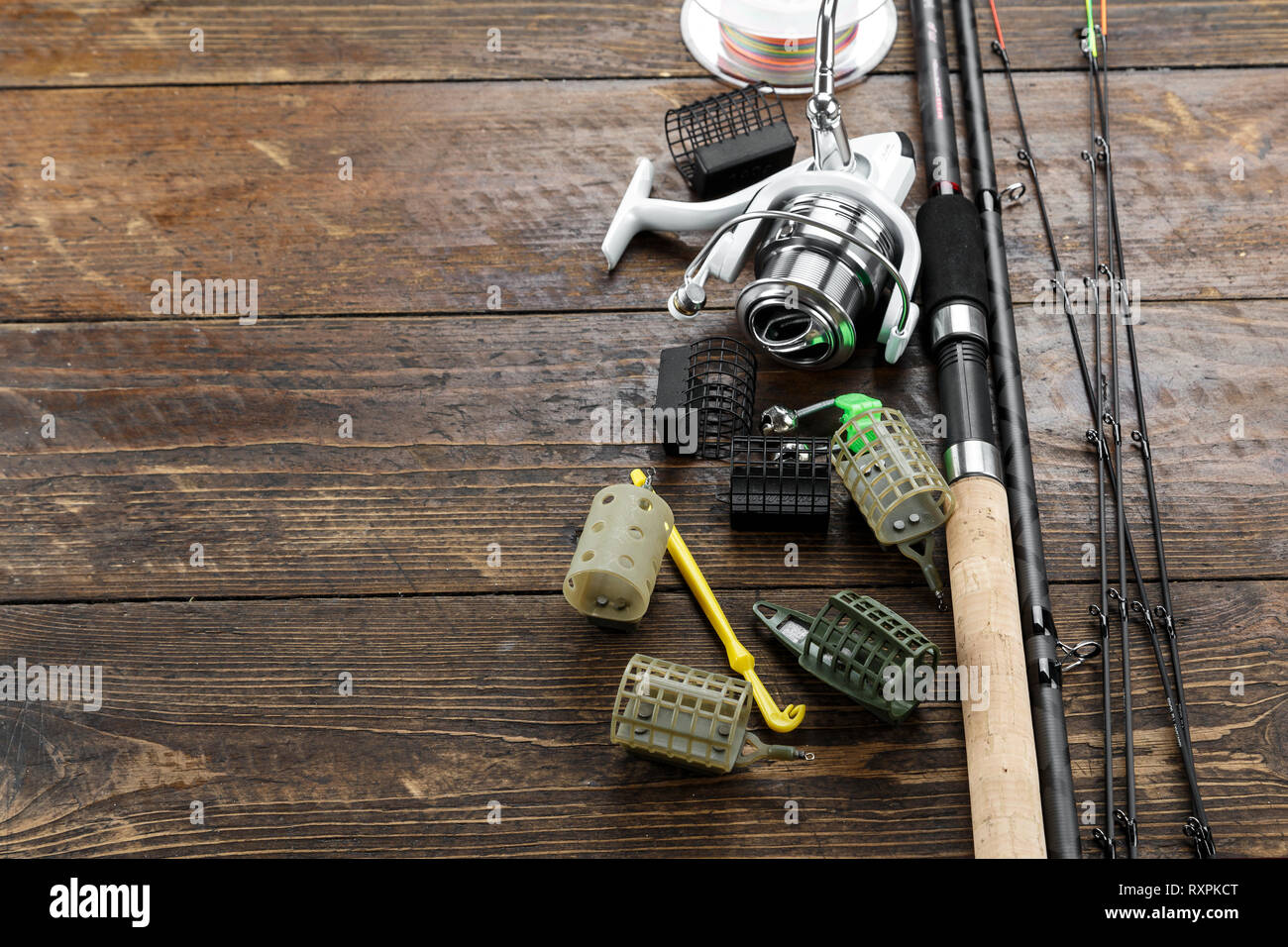 Fishing feeder and reel. Different tips of the feeder rod for bottom fishing.  space for tex Stock Photo - Alamy