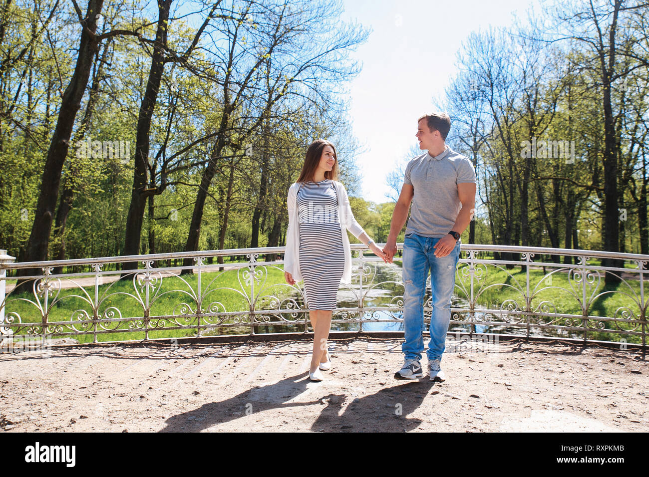 Happy future parents in summer day outdoor Stock Photo
