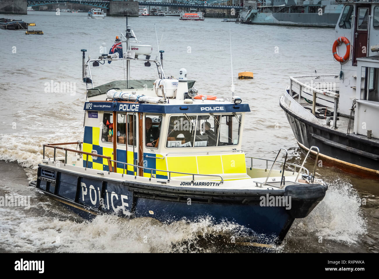 A River Thames Police patrol boat speeding down the River Thames in central London, England, United Kingdom, UK Stock Photo