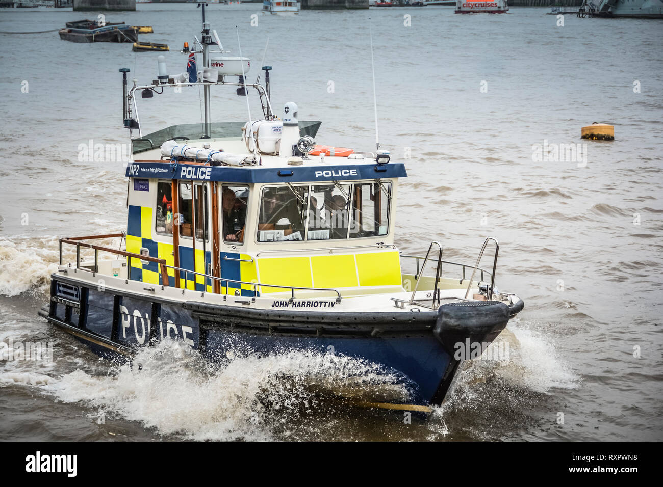 A River Thames Police patrol boat speeding down the River Thames in central London, England, United Kingdom, UK Stock Photo