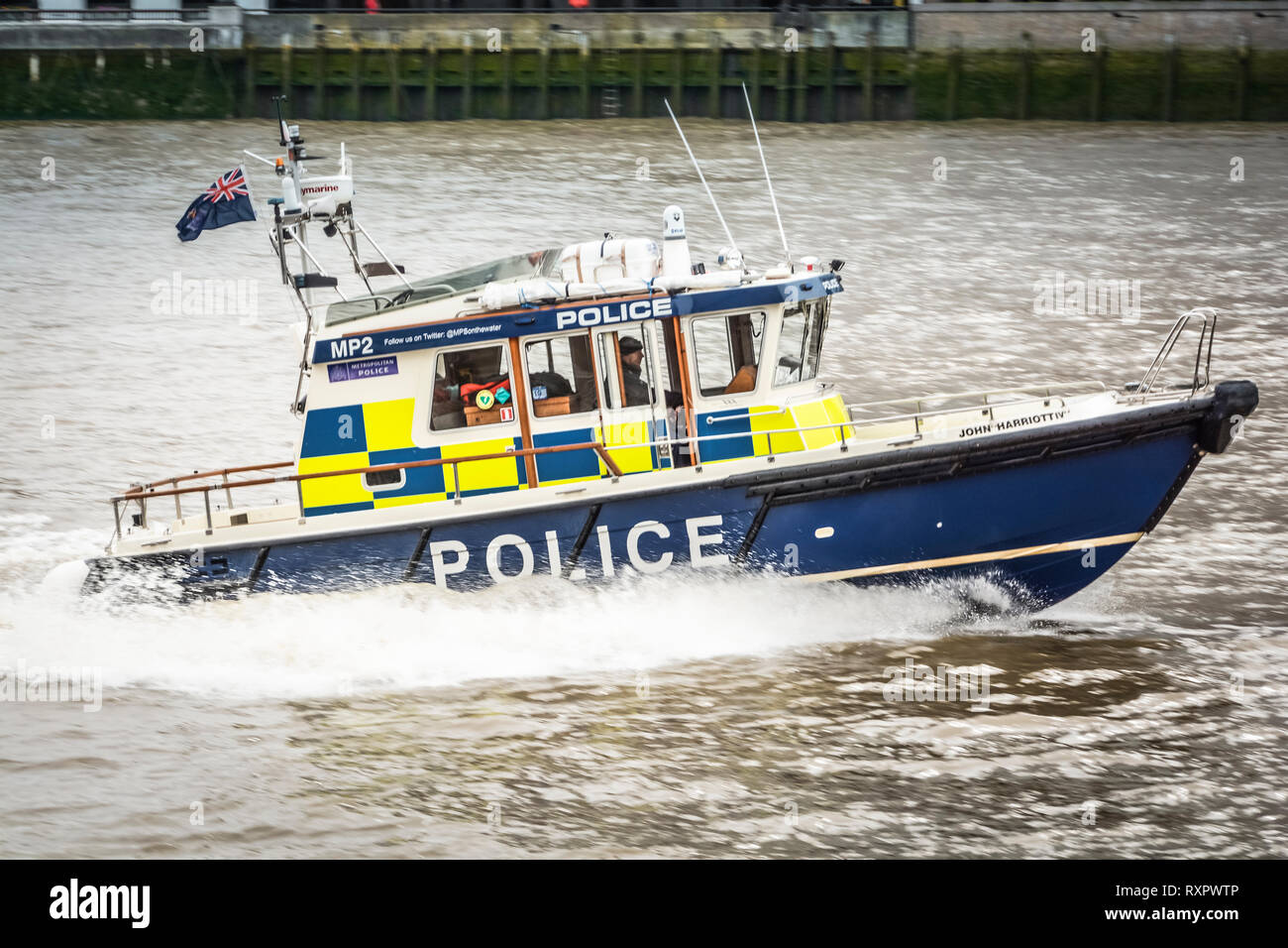 A River Thames Police patrol boat speeding down the River Thames in central London, England, United Kingdom, UK Stock Photo