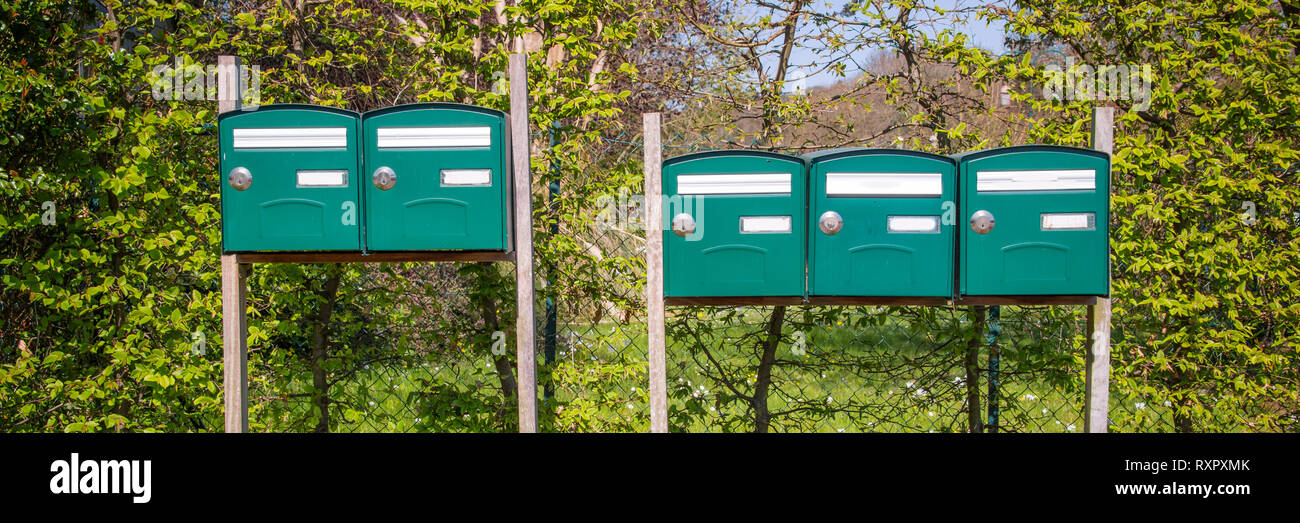 Range of mailboxes in the countryside, housing concept Stock Photo
