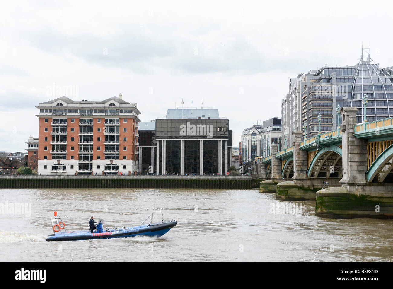 The Financial Times offices and headquarters on the south side of the river Thames on Southwark Bridge, London, UK Stock Photo