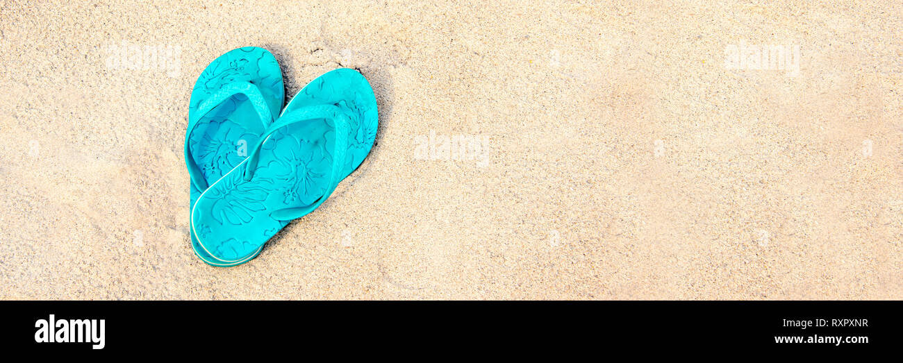 Blue pair of flip flops on the beach, panoramic summer concept Stock ...