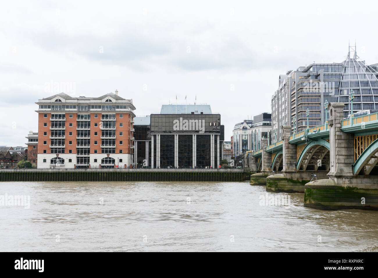 The Financial Times offices and headquarters on the south side of the river Thames on Southwark Bridge, London, UK Stock Photo