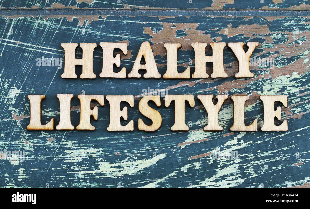 Healthy lifestyle written with wooden letters on rustic surface Stock Photo