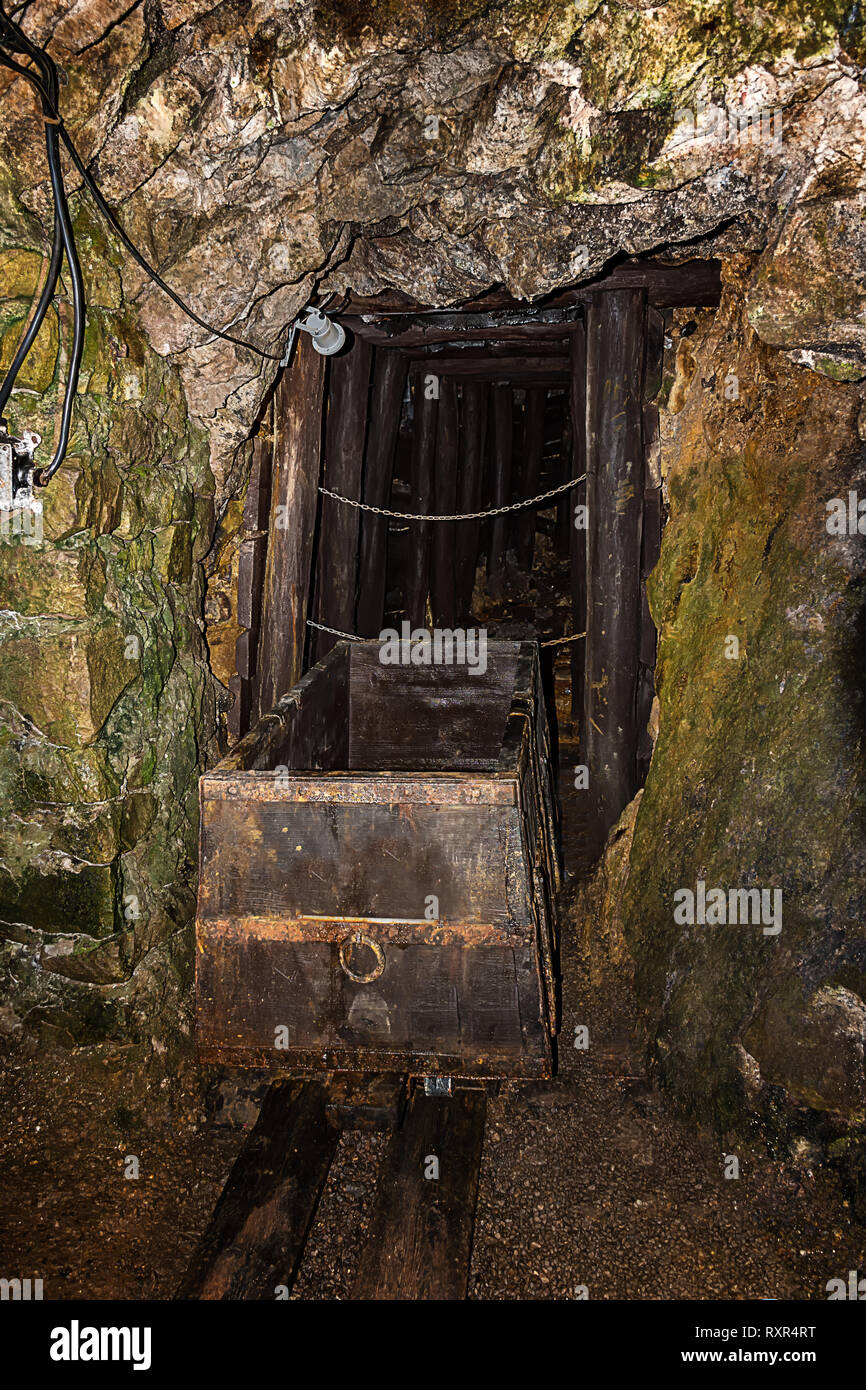 Old wooden mine chart in abandoned mine shaft with wooden timbering Stock Photo