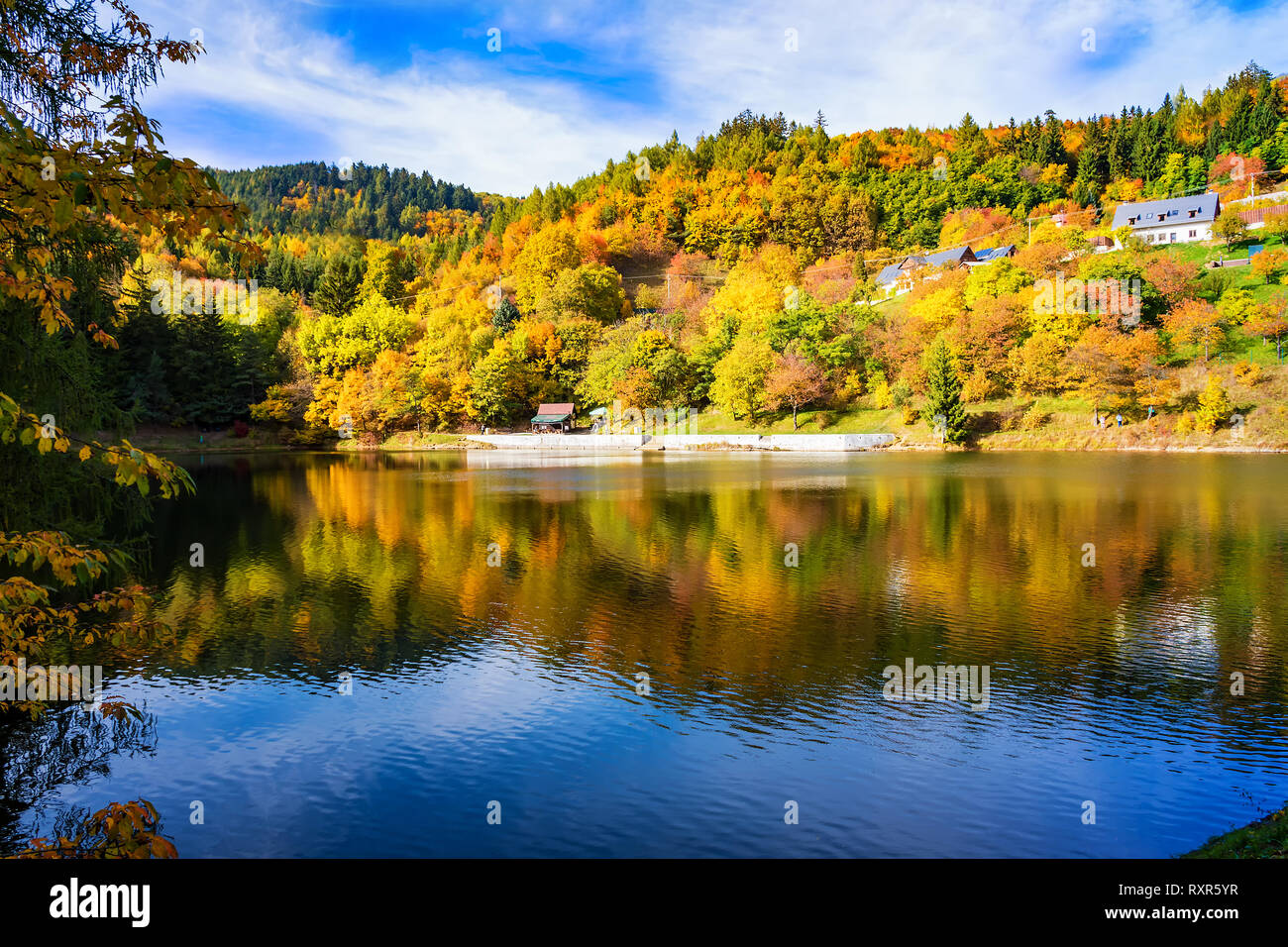 Beautiful reflection of colorful trees in water of lake during autumn ...