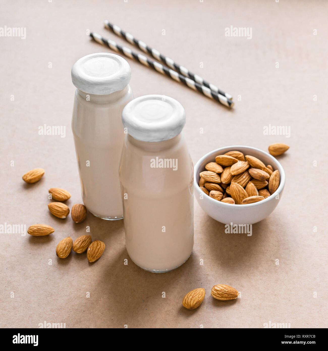 Almond Milk alternative on beige background, copy space. Healthy vegan