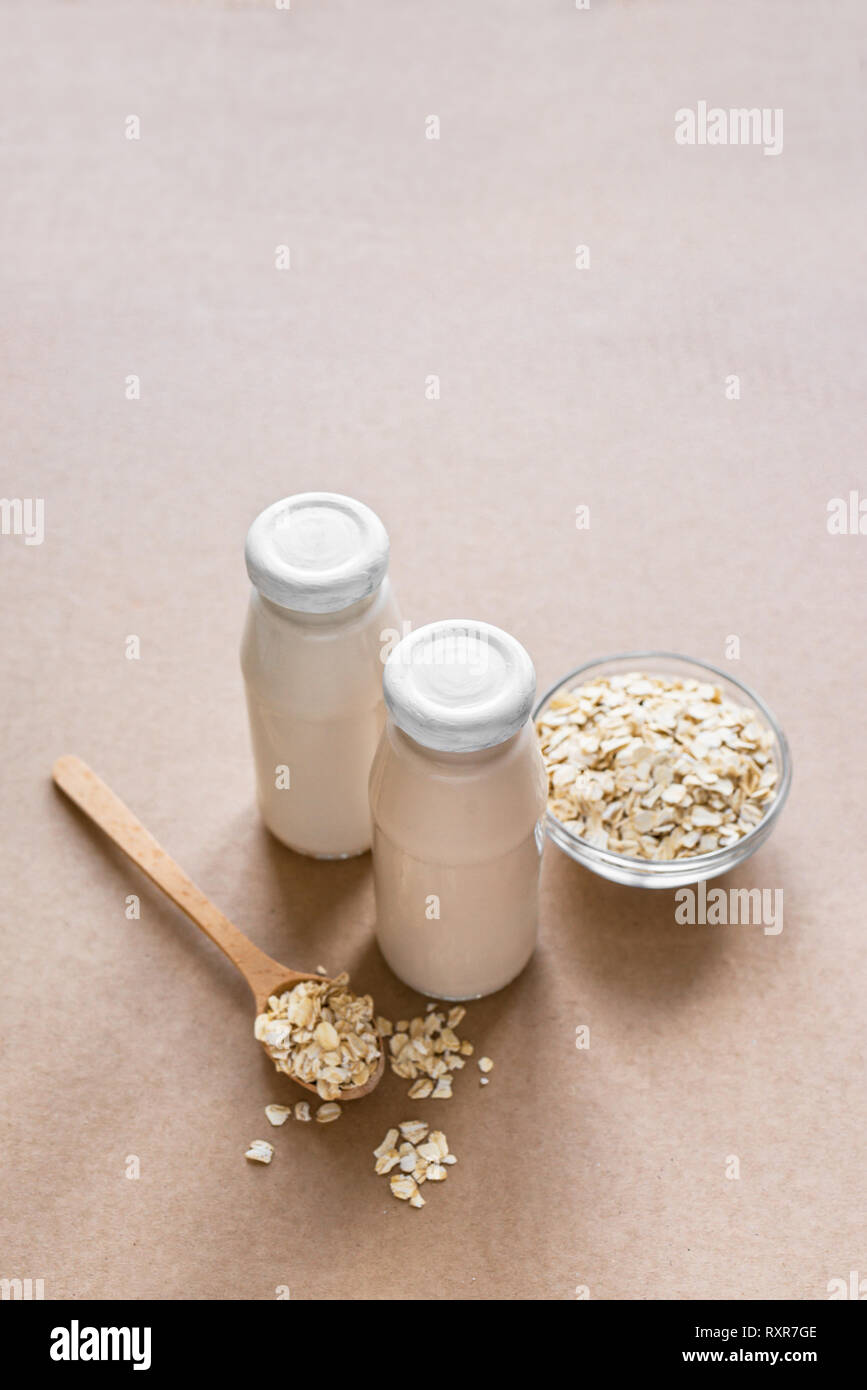 Oat Milk alternative on beige background, copy space. Healthy vegan