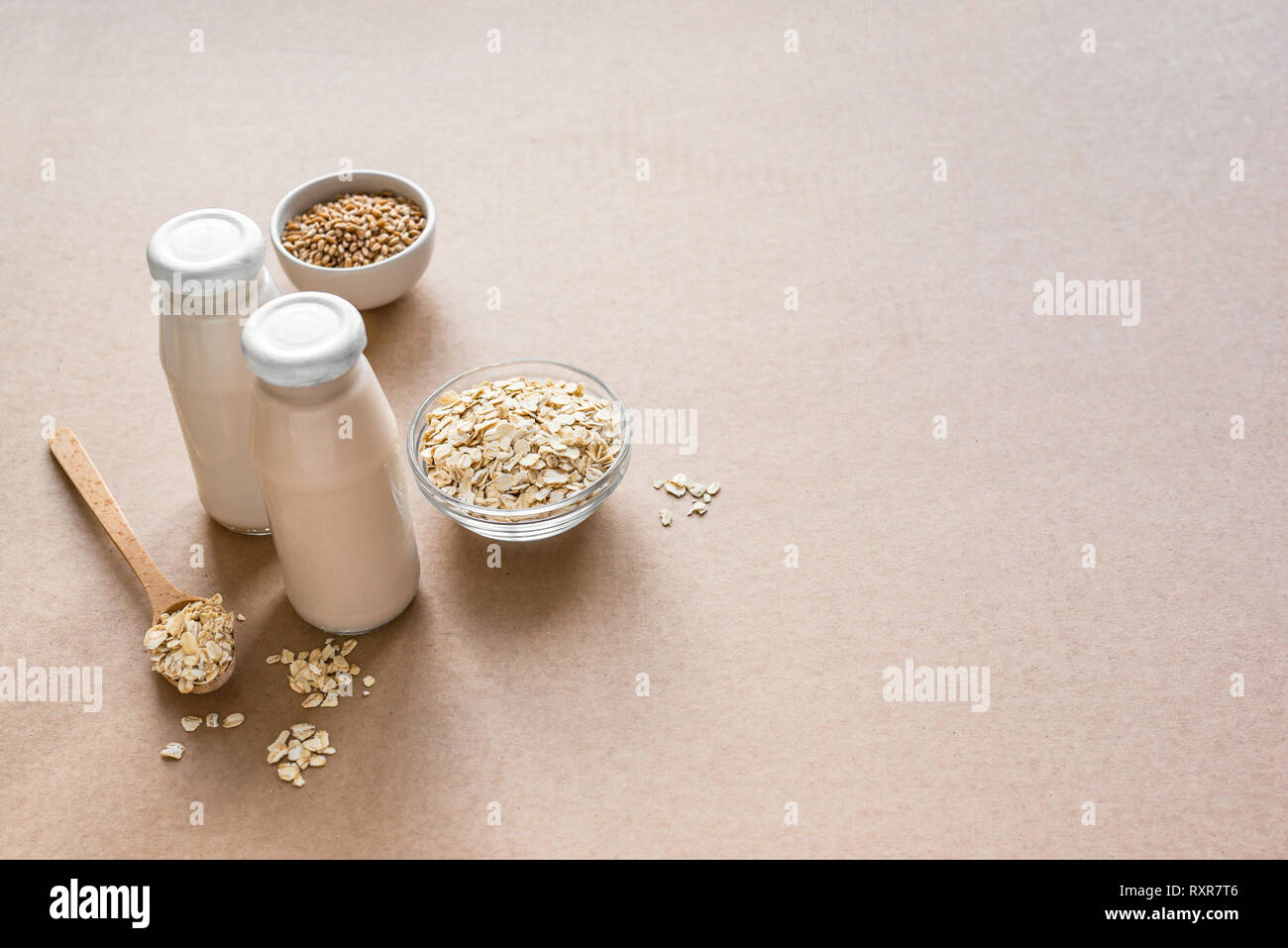 Oat Milk alternative on beige background, copy space. Healthy vegan