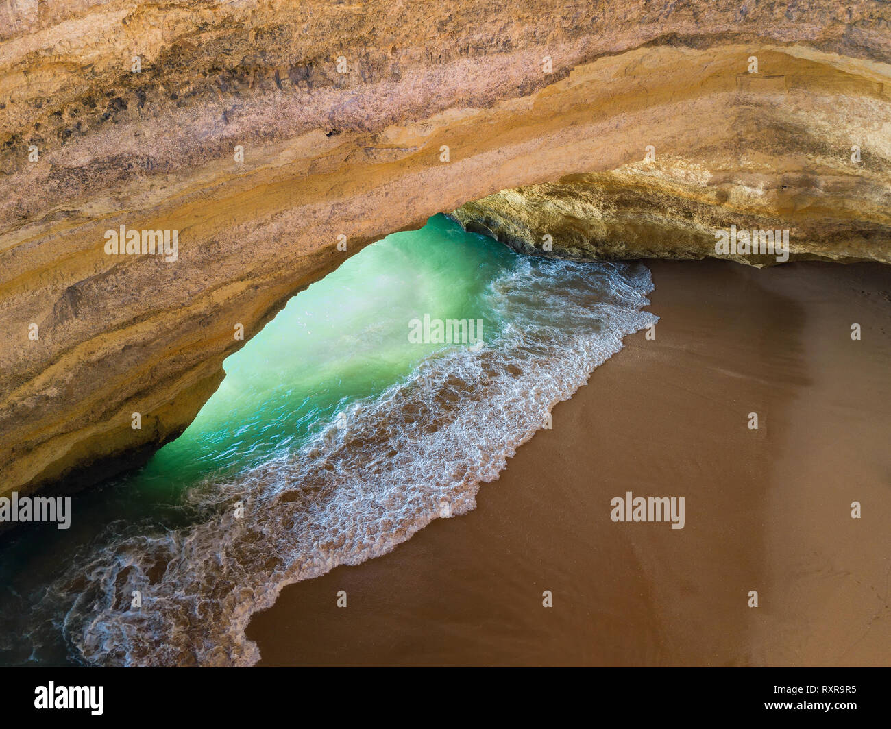 Famous natural cave at Benagil beach in Algarve Portugal.  landscape at one of the main holiday destinations in europe. Summer tourist attraction. Dro Stock Photo