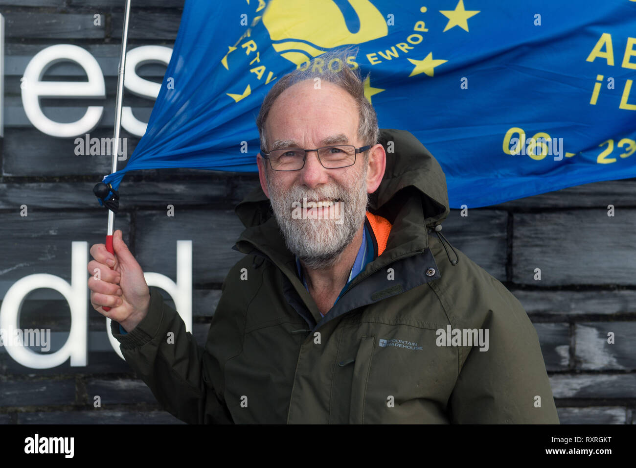 Cardiff, Wales, UK. 10th March 2019. Edmund Sides sets off from the Senedd building in Cardiff Bay on the Cardiff - Newport leg of his walk. He is walking from Swansea to London to join the People's Vote march on 23rd March.   Setting off from Swansea on Wednesday 6th March, Ed aims to arrive in London on 22nd March, in time to join other Swansea for Europe campaigners who will be flying the flag for Swansea at the People’s Vote march.  The last march, in October, was one of the biggest in British history, drawing 700,000 people. Credit: Polly Thomas/Alamy Live News Stock Photo