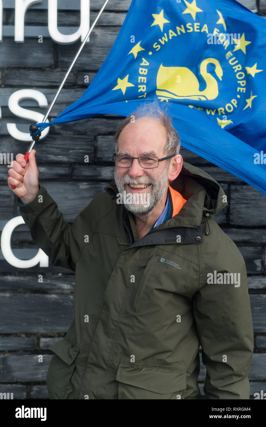 Cardiff, Wales, UK. 10th March 2019. Edmund Sides sets off from the Senedd building in Cardiff Bay on the Cardiff - Newport leg of his walk. He is walking from Swansea to London to join the People's Vote march on 23rd March.   Setting off from Swansea on Wednesday 6th March, Ed aims to arrive in London on 22nd March, in time to join other Swansea for Europe campaigners who will be flying the flag for Swansea at the People’s Vote march.  The last march, in October, was one of the biggest in British history, drawing 700,000 people. Credit: Polly Thomas/Alamy Live News Stock Photo