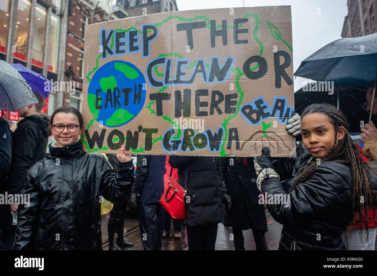Amsterdam, North Holland, Netherlands. 10th Mar, 2019. The first young  climate strikers in The Netherlands Jovanna van den Berg is seen holding a  big placard at the beginning of the demonstration.The largest