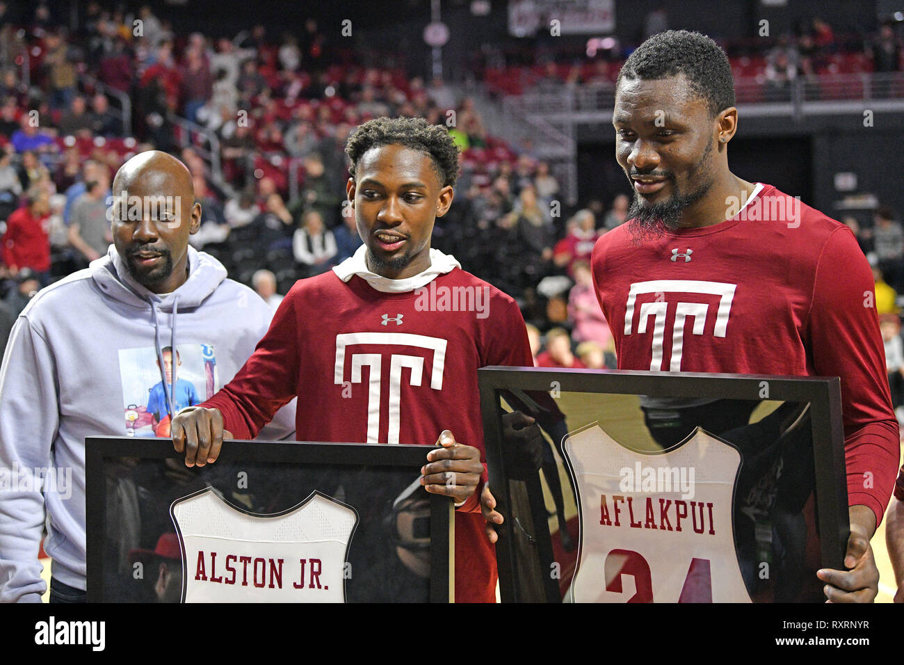 Philadelphia, Pennsylvania, USA. 9th Mar, 2019. Temple Owls guard SHIZZ ALSTON JR. (10) and center ERNEST AFLAKPUI (24) are honored in senior day ceremonies prior to the American Athletic Conference basketball game played at the Liacouras Center in Philadelphia. Temple beat #25 UCF 67-62. Credit: Ken Inness/ZUMA Wire/Alamy Live News Stock Photo