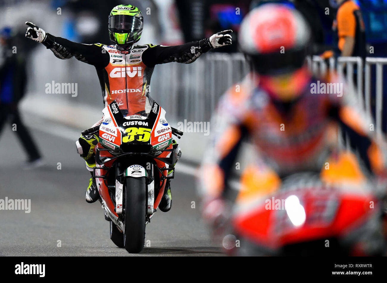 Doha, Qatar. 10th Mar, 2019. LCR Honda team's British rider Cal Crutchlow celebrates after the MotoGP race of the 2019 MotoGP Grand Prix of Qatar in Losail Circuit of Doha, capital of Qatar, on March 10, 2019. Cal Crutchlow took the third place with 42 minutes and 37.222 seconds. Credit: Nikku/Xinhua/Alamy Live News Stock Photo