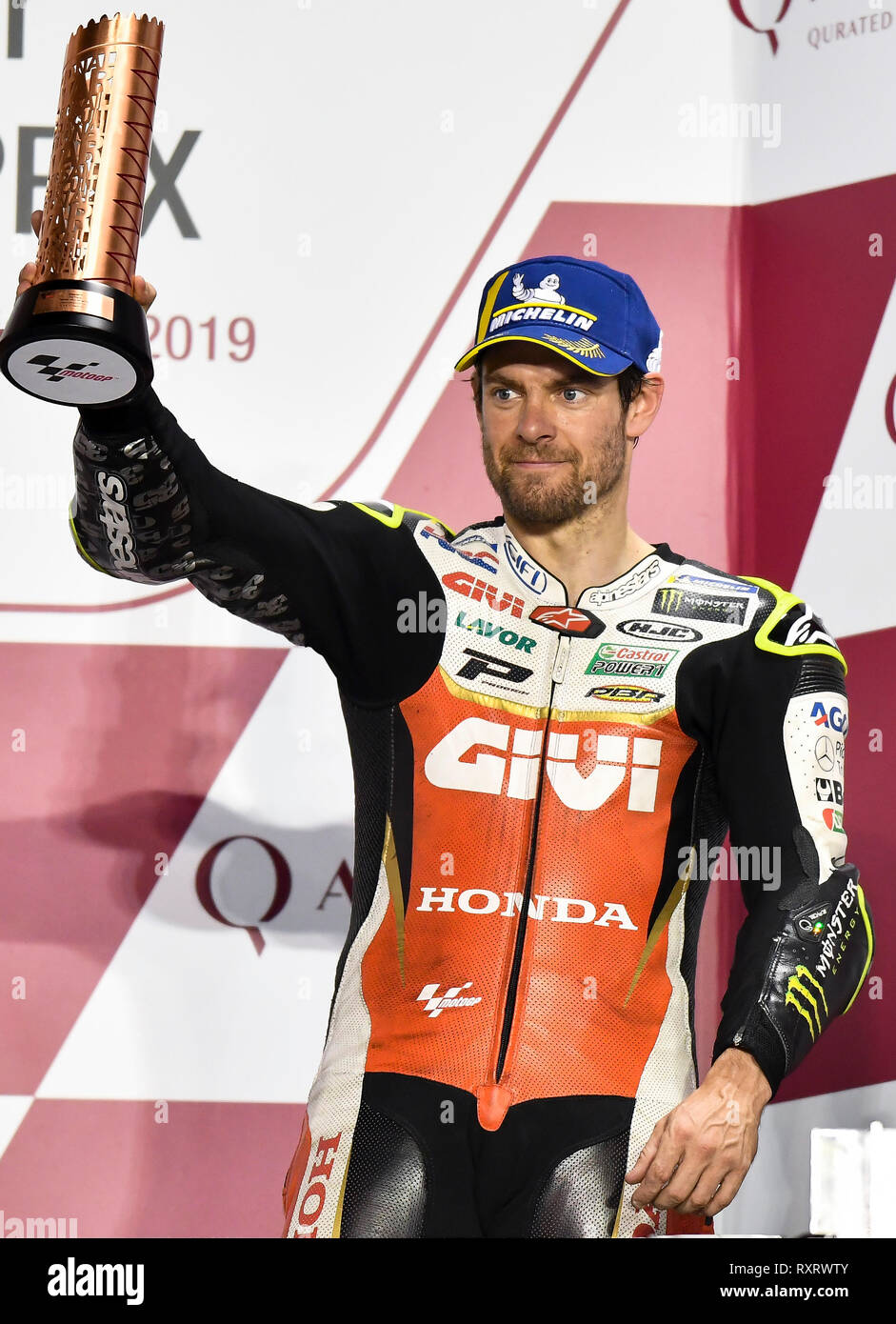 Doha, Qatar. 10th Mar, 2019. LCR Honda team's British rider Cal Crutchlow celebrates during the awarding ceremony for the MotoGP race of the 2019 MotoGP Grand Prix of Qatar in Losail Circuit of Doha, capital of Qatar, on March 10, 2019. Cal Crutchlow took the third place with 42 minutes and 37.222 seconds. Credit: Nikku/Xinhua/Alamy Live News Stock Photo