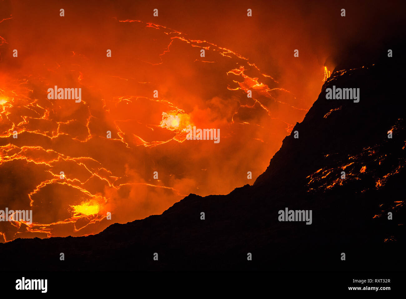 The lava lake at the top of Nyiragongo Volcano in the DRC Stock Photo ...