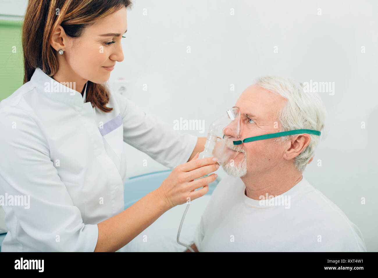 Senior man preparing to procedure inhalation at hospital Stock Photo