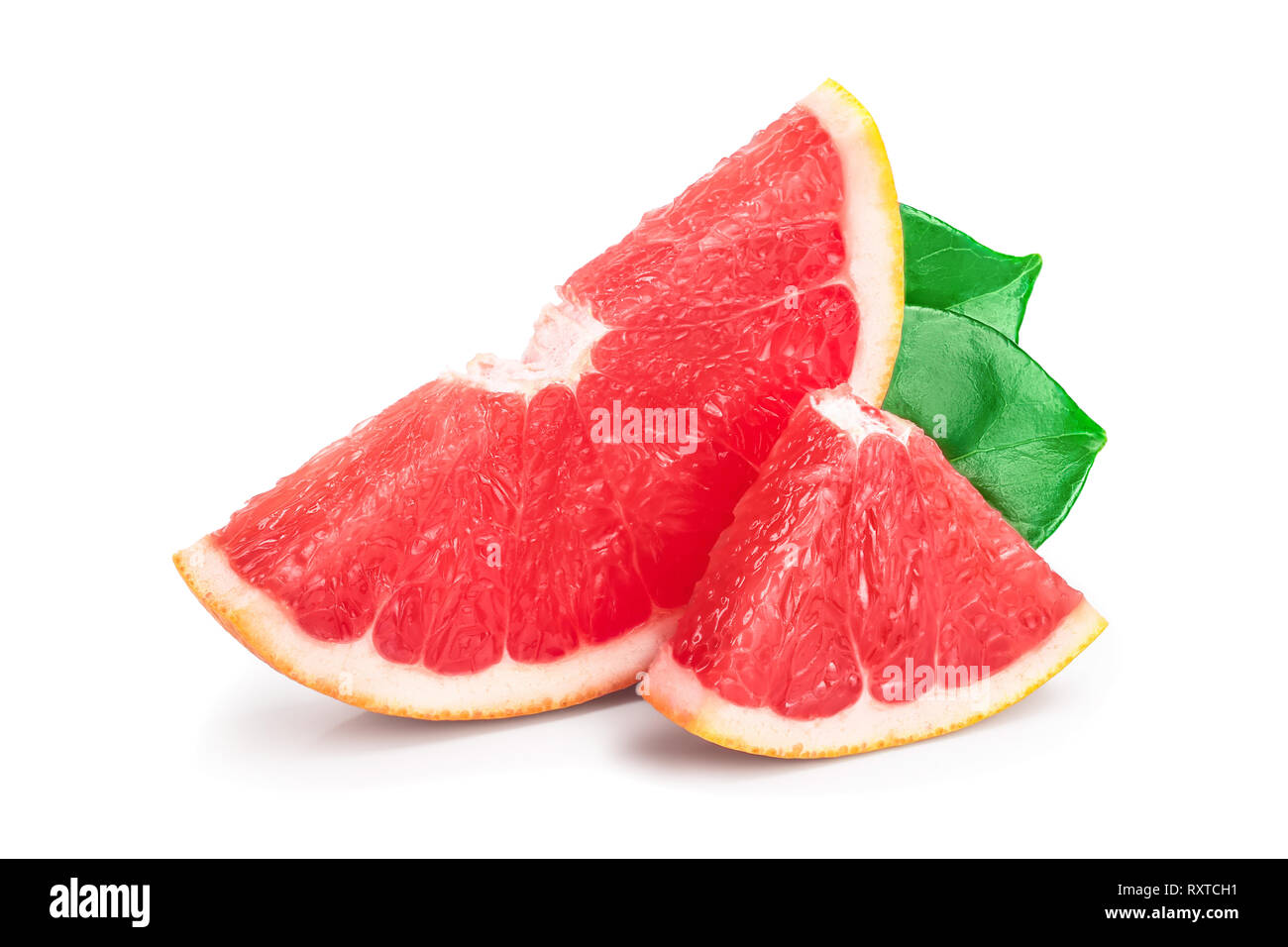 Grapefruit slices with leaves isolated on white background. Stock Photo