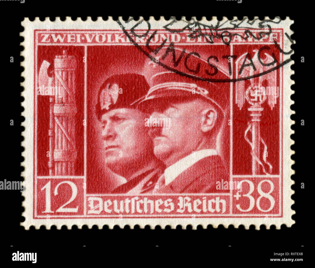 Historical stamp: German-Italian brotherhood in arms, Portraits of Hitler and Mussolini with symbols of the Nazi and fascist regime two countries Stock Photo