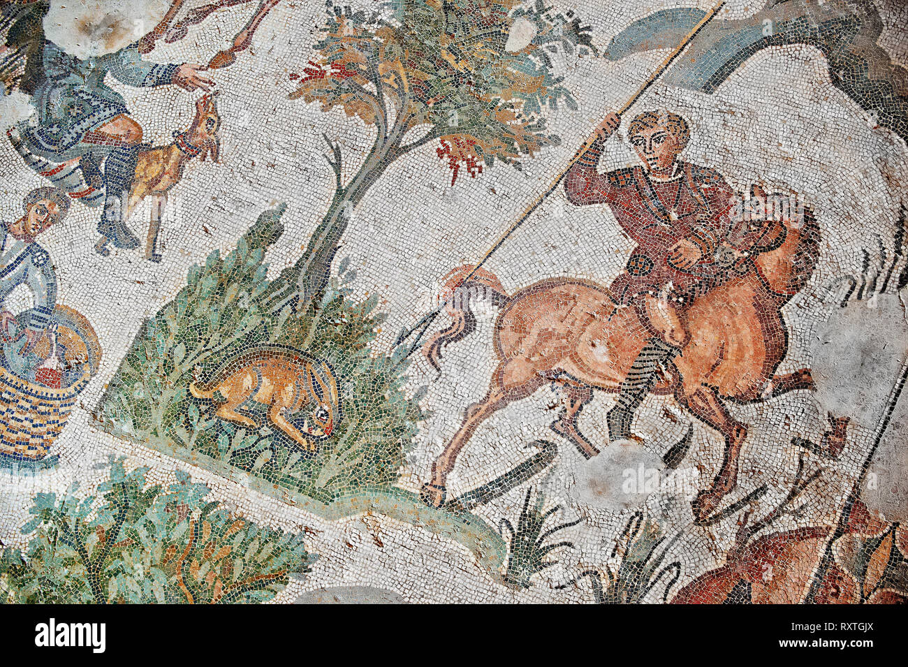 Hunter about to spear a hare From the Room of The Small Hunt, no 25 - Roman mosaics at the Villa Romana del Casale which containis the richest, larges Stock Photo
