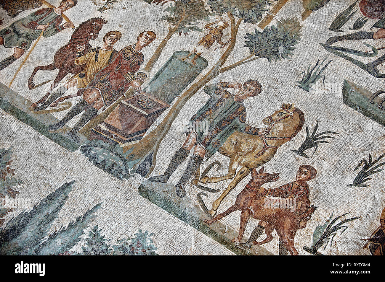 Hunters making an offering at an altar. Roman mosaic floor of the Room of The Small Hunt, no 25 - Roman mosaics at the Villa Romana del Casale ,  circ Stock Photo