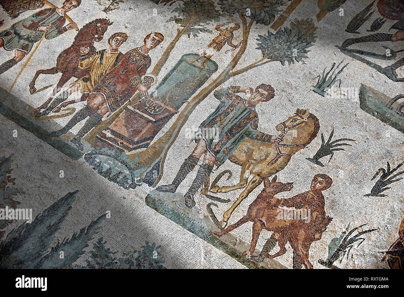 Hunters making an offering at an altar. Roman mosaic floor of the Room of The Small Hunt, no 25 - Roman mosaics at the Villa Romana del Casale ,  circ Stock Photo