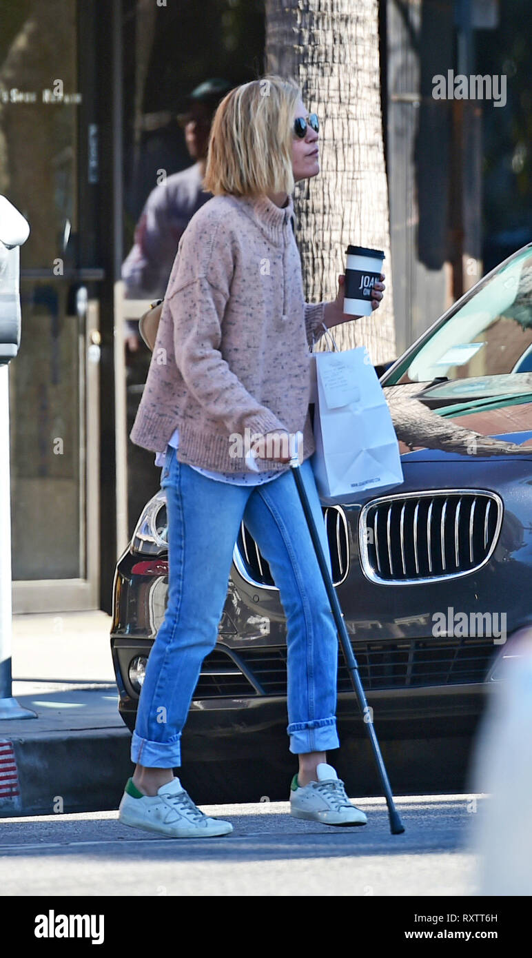 Selma Blair uses a cane to walk to her car from Joan's On Third just